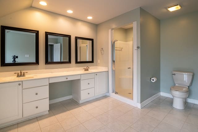 Where should bathroom mirrors be placed