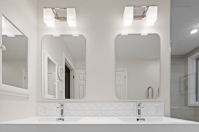 vertical mirrors in white bathroom